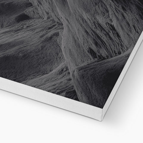 A soft white paper image on a picture plate of rock.