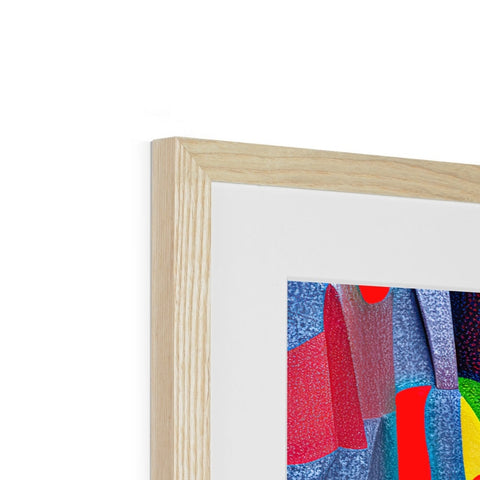 An art print wrapped in wood in a wooden frame on a table.