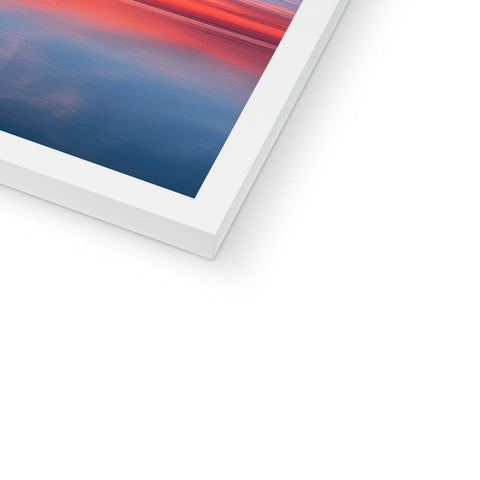 A white iPad tablet is in front of a black and white picture on a screen.