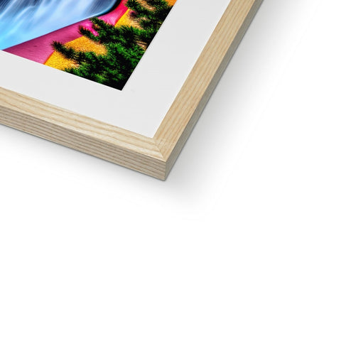 A printed photo of a painting sitting on top of a photo book in a wooden frame