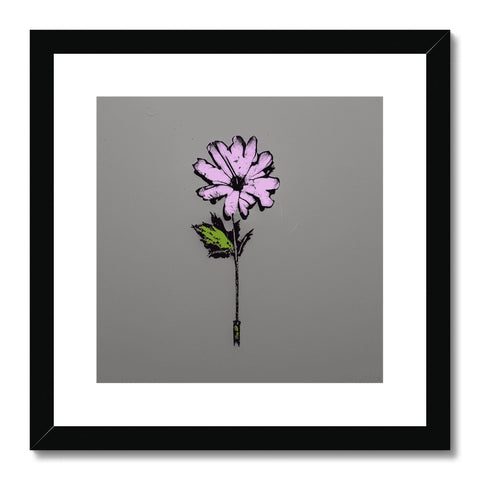 A pink and purple flower in a glass  panoramic scene framed in white wood
