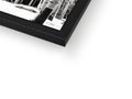 a white picture frame with a black and white photograph with an album on it