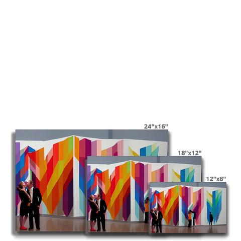 A white wall with colored screens covered in windows and panels is painted in a mural.