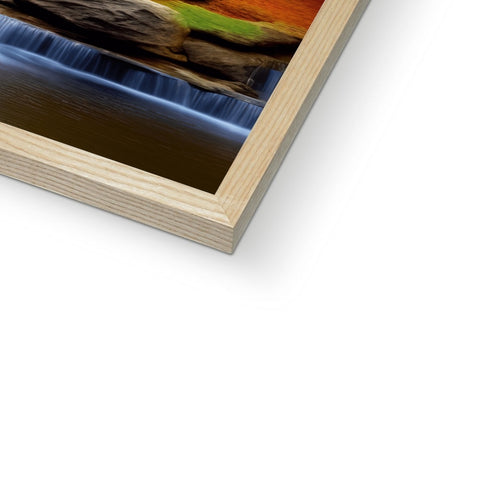 A softcover art print in a wood frame made of brushed wood