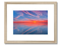 An artwork framed photograph of a beautiful sunset with colorful brushstrokes.