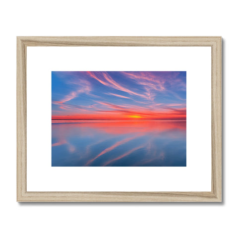 An artwork framed photograph of a beautiful sunset with colorful brushstrokes.