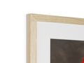A picture frame with wooden edges on it with a bird on top of it.