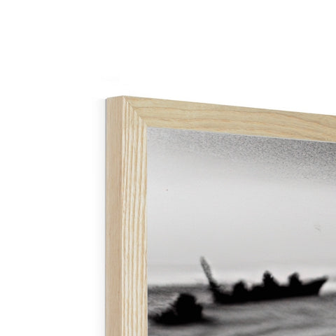 a photo frame with a wooden sculpture of a boat on it