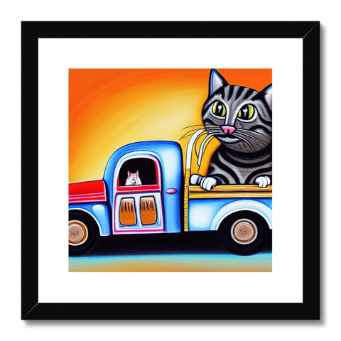 A cat with whiskery fur sitting inside of a small motor home with a painting on