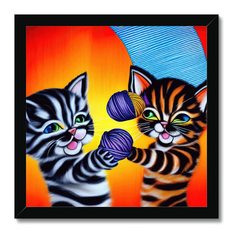 A couple of cats playing with a needlepoint art print.