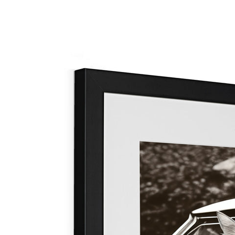 A picture of a picture frame with one arm folded with a black and white photograph in
