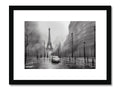 Art print of an image of Paris on top of a building on a wooden frame.