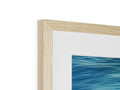 A wooden picture frame hanging on a wall. 