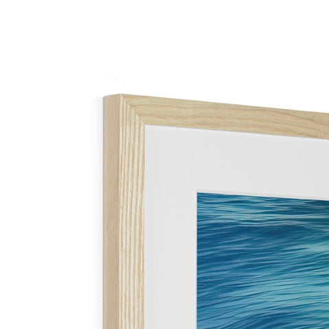 A wooden picture frame hanging on a wall. 