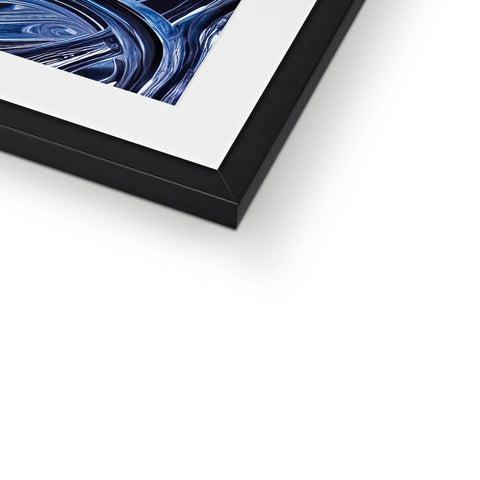 A blue picture behind a metal image of a photograph sitting on an object in the frame