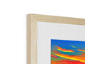 A photograph of an art print in a frame on top of a wooden base.