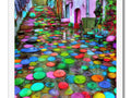A tile floor with colorful tiles with colorful umbrellas that are covered in various images