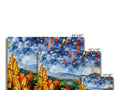 Several pictures of autumn trees and fall foliage on a wall of ceramic tile.