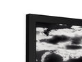 A black and white television monitor shows a black cloud outside.