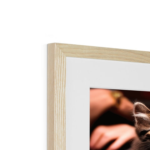 there is a cat standing in an attractive wood frame with a photo of her cat on