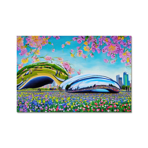 A collection of colorful pictures displayed on a table along with a white mouse pad on a