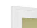 A picture frame on a wall and white lighting are positioned under some picture frames.
