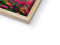 A photo of a picture that is wrapped in a wooden frame on a book.