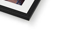 A view of a framed photo sitting on top of a picture frame with a silver frame