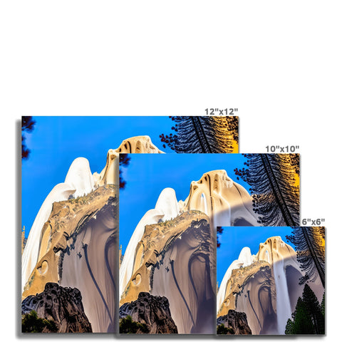 Three images in different backgrounds on a large wall with blue mountains.