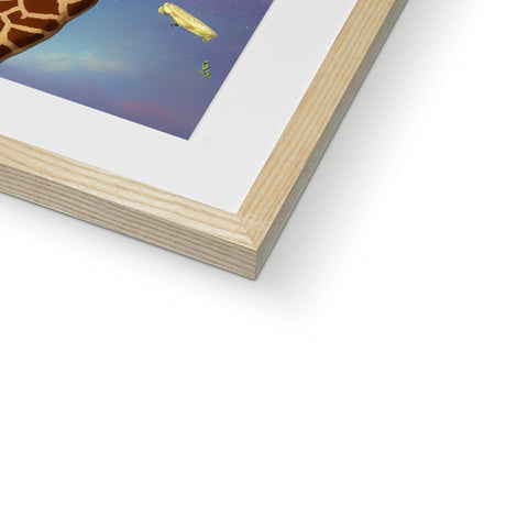 A giraffe peeks under a picture on a book covering a wall