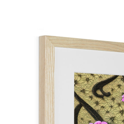 An art print is in a wooden frame on a wooden stand.