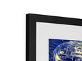 A bedside table with a framed photo of the moon on it and other pictures on