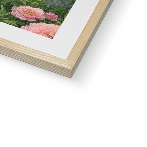 An art print is placed on top of a wooden frame.