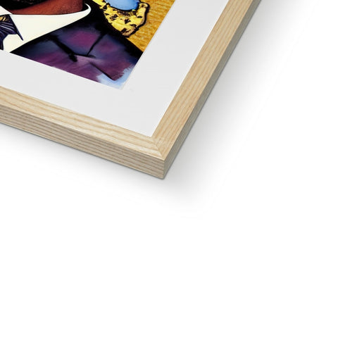 A book with two photographs sitting in a wooden wooden frame filled with colored sheets.