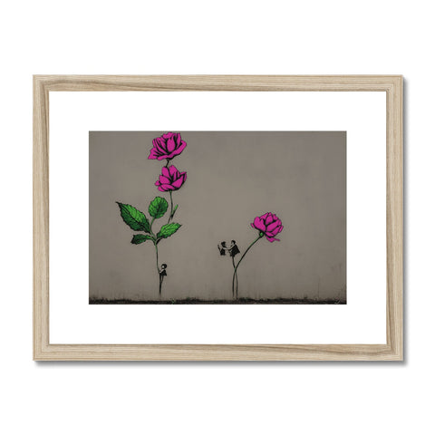 A framed framed art print of one flower with another two pink flowers on it.