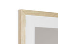 A picture frame has a piece of wood in it above a mirror.