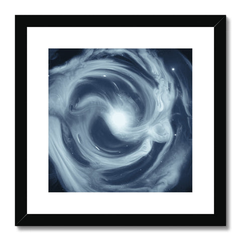 A framed picture of a large swirling vortex on a wood background.