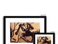 A large picture frame with a guitar on a black pillow with an illustration on a wooden