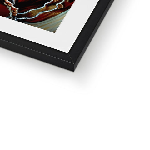 A photo of a person holding an art print in a picture frame.