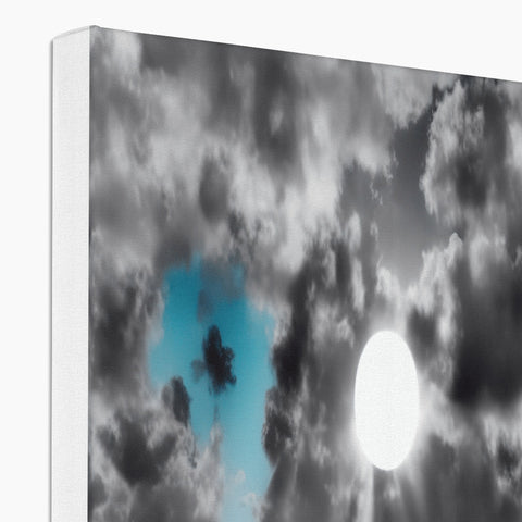 A white softcover photograph of a TV with clouds.