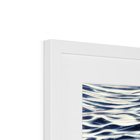 A picture frame on a wall with water hanging on it and a white background.