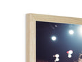 A photo picture frame with a photograph on it of a lighted wall.