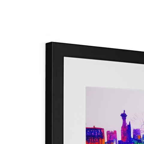 A glass framed picture of a picture of the city skyline on a silver table top with