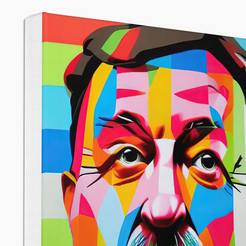 A book with colorful art on its cover beside a canvas.