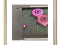 a beautiful art print of a dead flower on a frame with graffiti spray on it