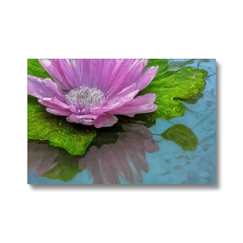 A purple flower with water lilies sitting on top of an art print.