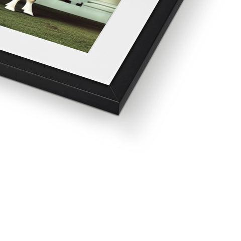 A picture frame holding a photo with a black and white background.