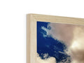 Wood panels on a white photo frame are sitting on a frame.