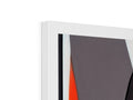 A white painting on a wall frame is holding an orange frame.