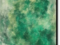 A painting of ocean waves and green grass on a green border painted onto a piece of